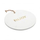 round cheese serving board made from white marble, and the word enjoy marked in brass