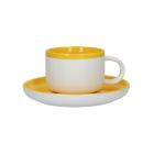 a tea cup and saucer set made from ceramic with a bright yellow and white design