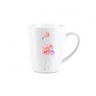 small white ceramic latte mug with a floral flamingo design