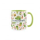 Green and white ceramic mug with camping equipment and text print