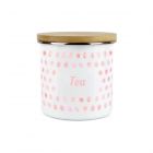 an enamel tea storage canister with a pink polka dot design