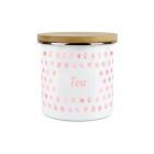 an enamel tea storage canister with a pink polka dot design