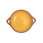 small round terracotta tapas dish with yellow glaze