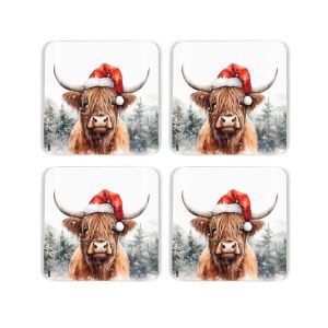 set of four highland cow print cork coasters featuring a novelty santa hat and snow