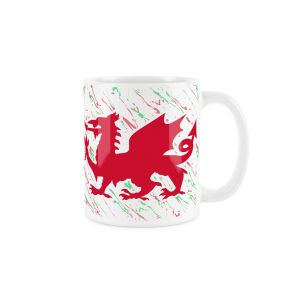 White ceramic mug with a red welsh dragon and splattered red and green background