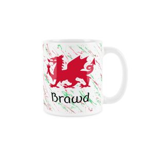 White ceramic mug with a red welsh dragon,splattered red and green background and brawd (brother) text