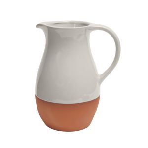 a large terracotta serving jug with a stone coloured glaze finish