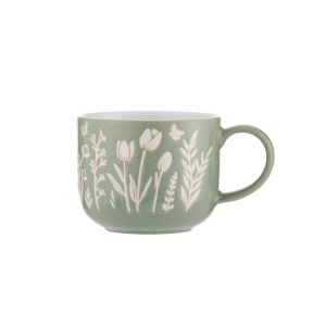 a green reactive glaze mug with a floral print