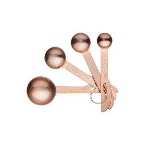 Set of four copper-finish stainless stell measuring spoons, with measurements from 1/4 teaspoon to 1 tablespoon.
