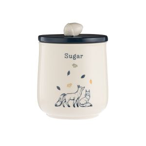 Woodland themed illustration of two foxes playing amongst falling leaves on a cream coloured canister with a navy blue coloured lid and an acorn shaped handle.